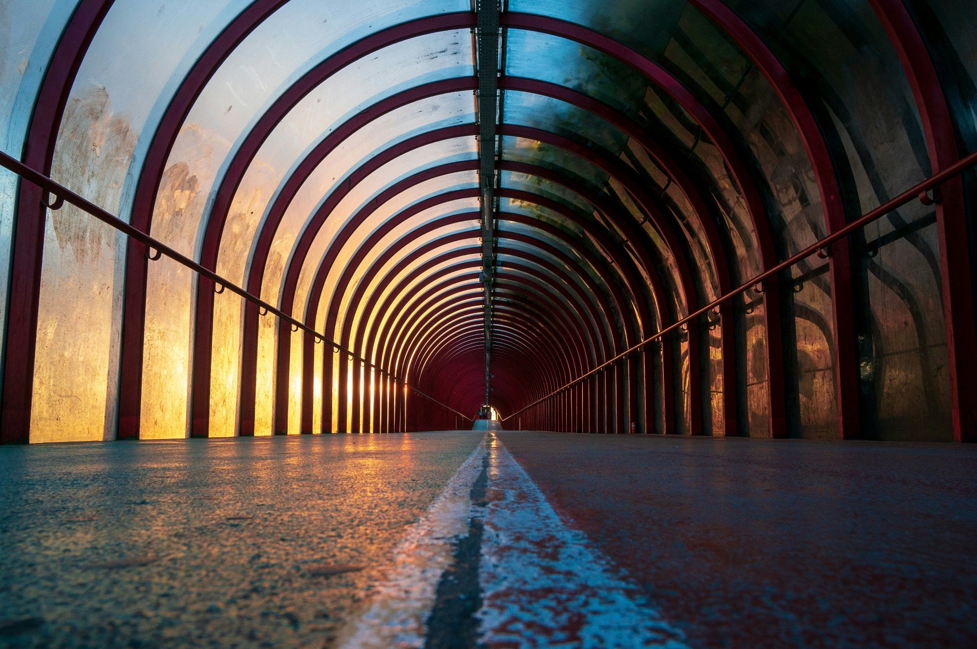 Long tunnel with arches and a light at the end